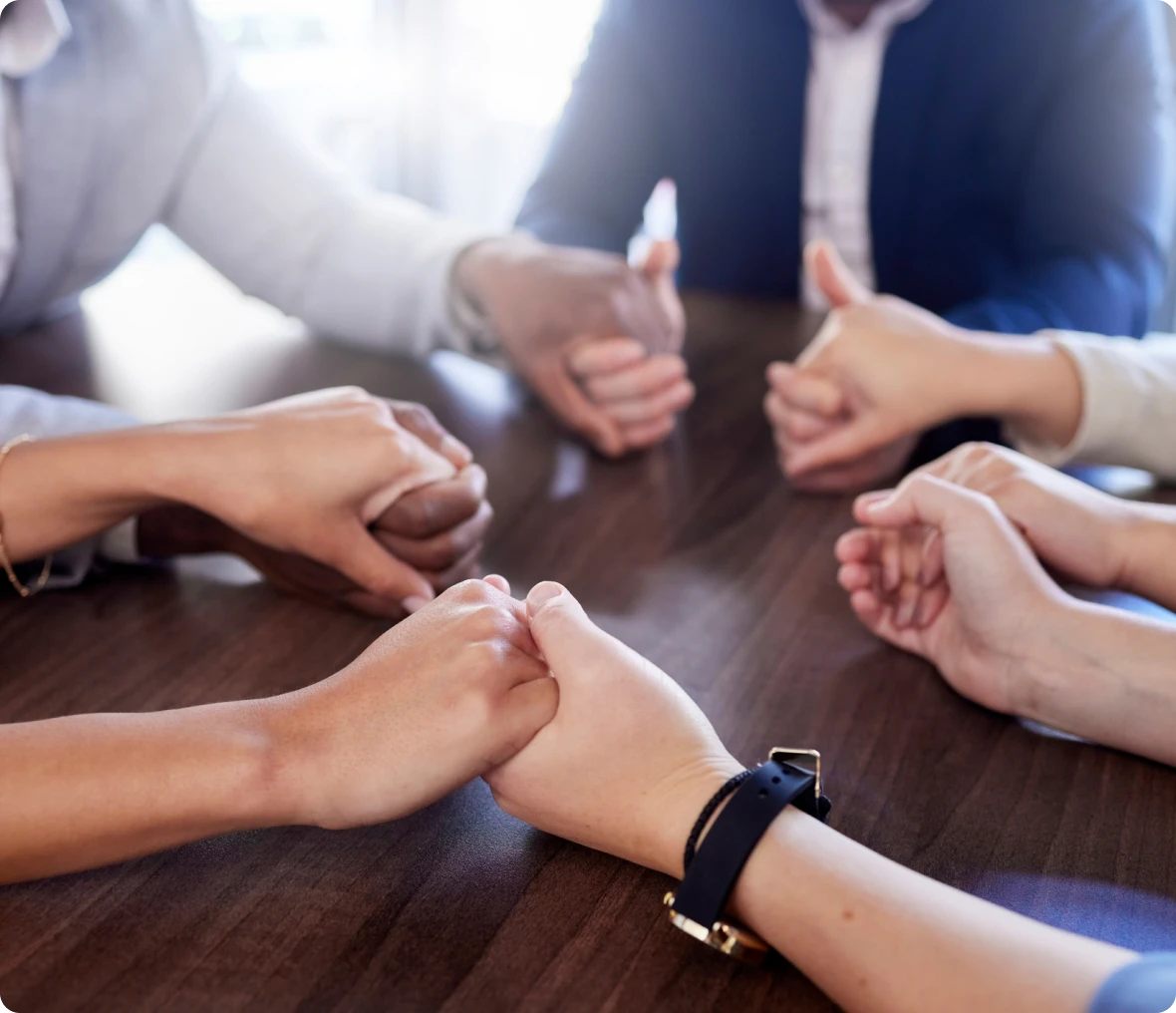 Hands joined in a group circle