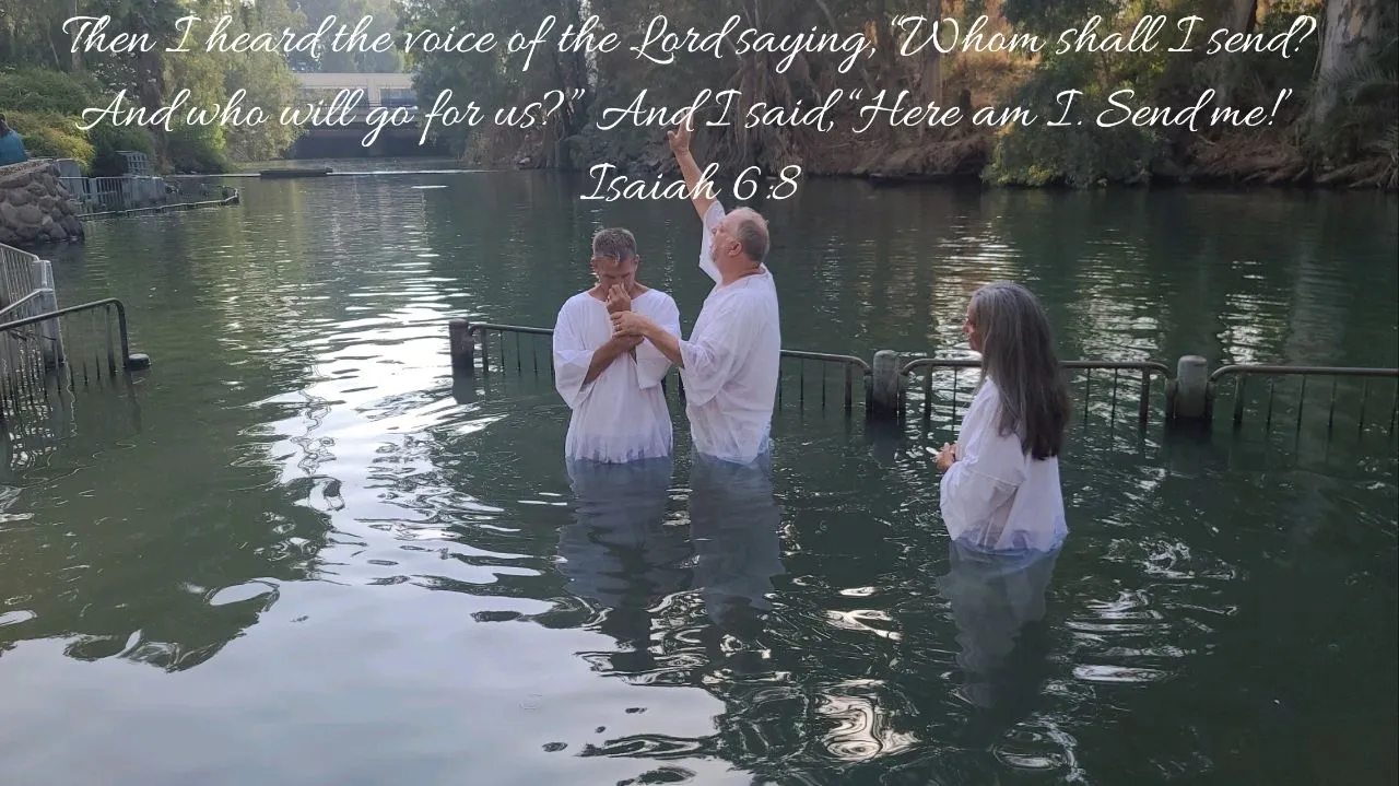 People in white garments during baptism