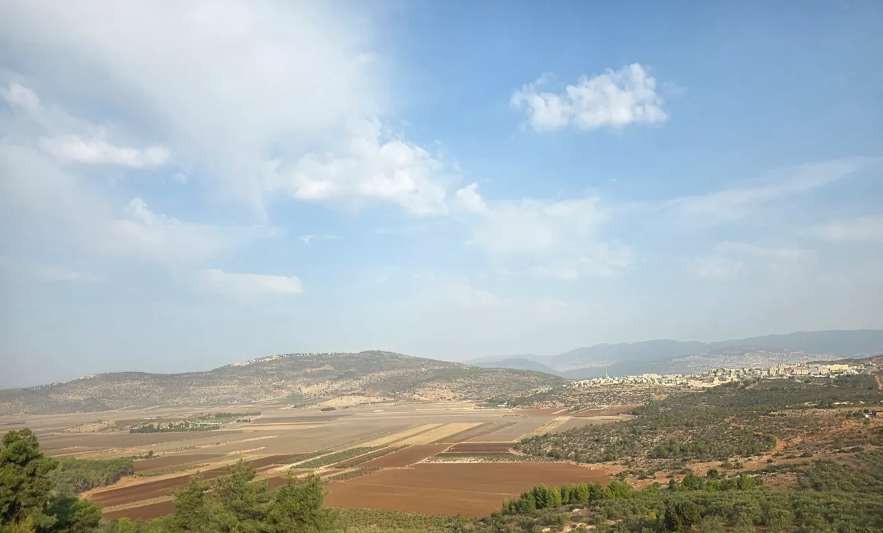 Rural fields with distant hills
