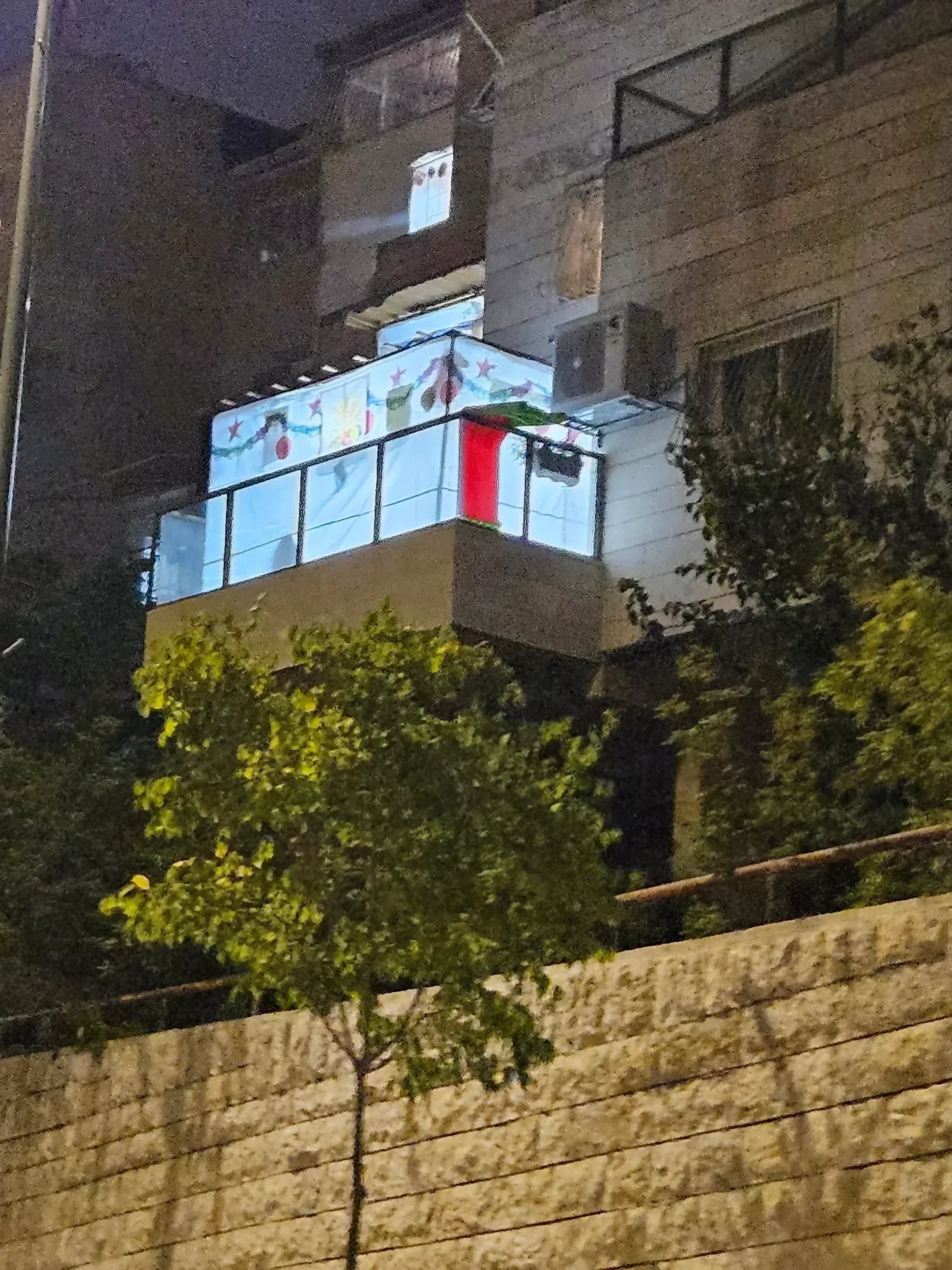 Residential building with lit balcony