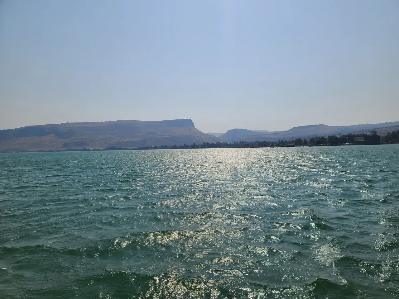 Sparkling lake with distant hills