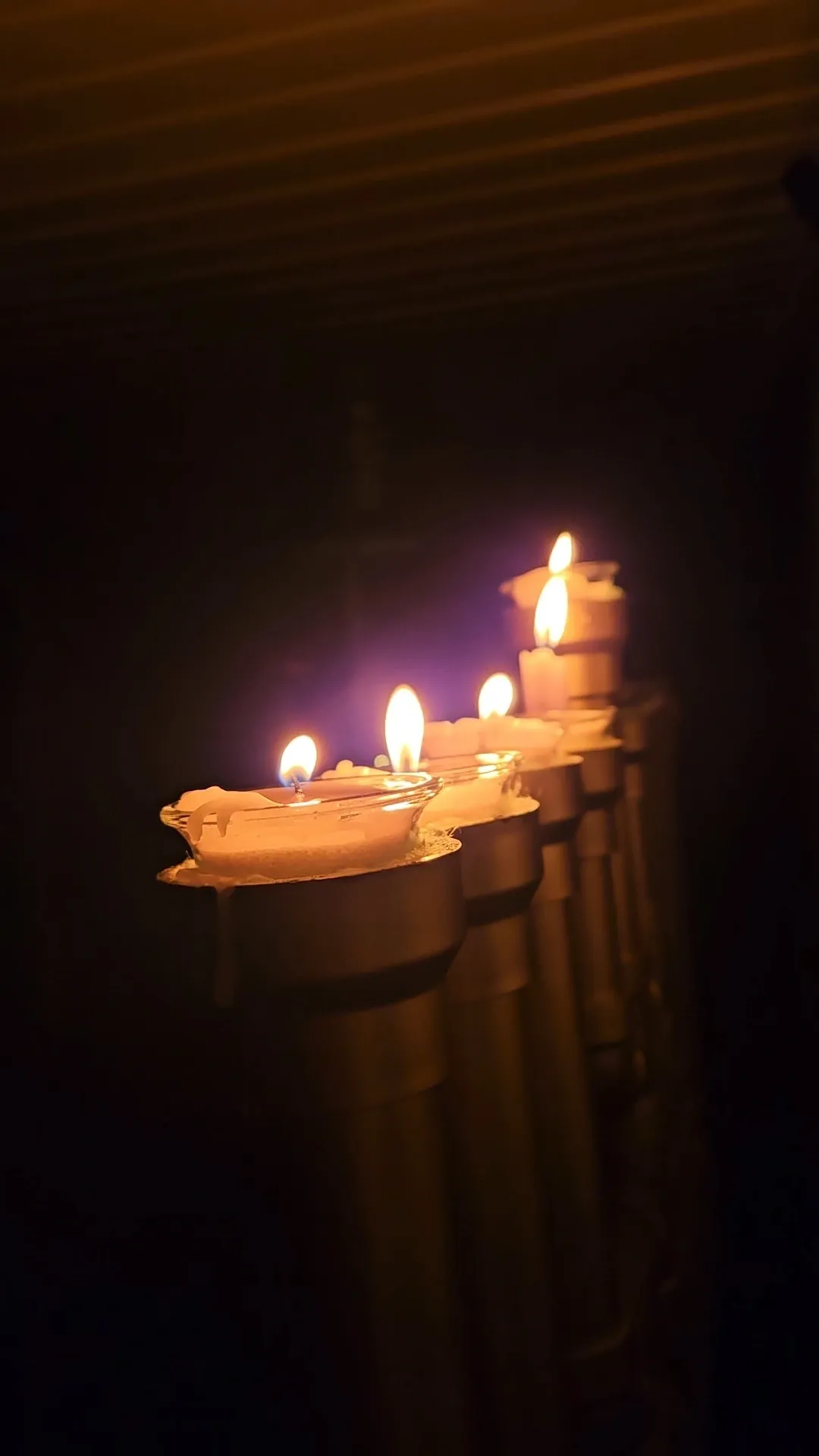 Glowing candles lined in a row