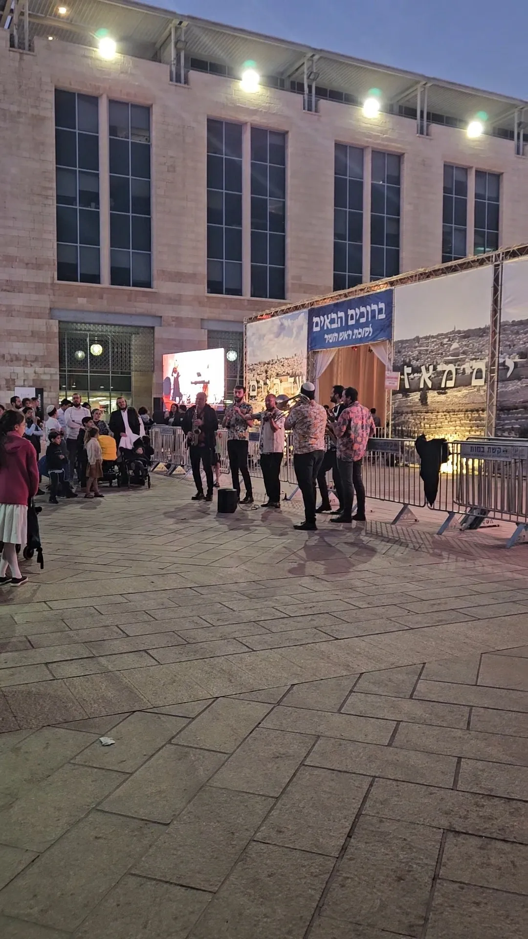 Crowd outside modern architectural structure