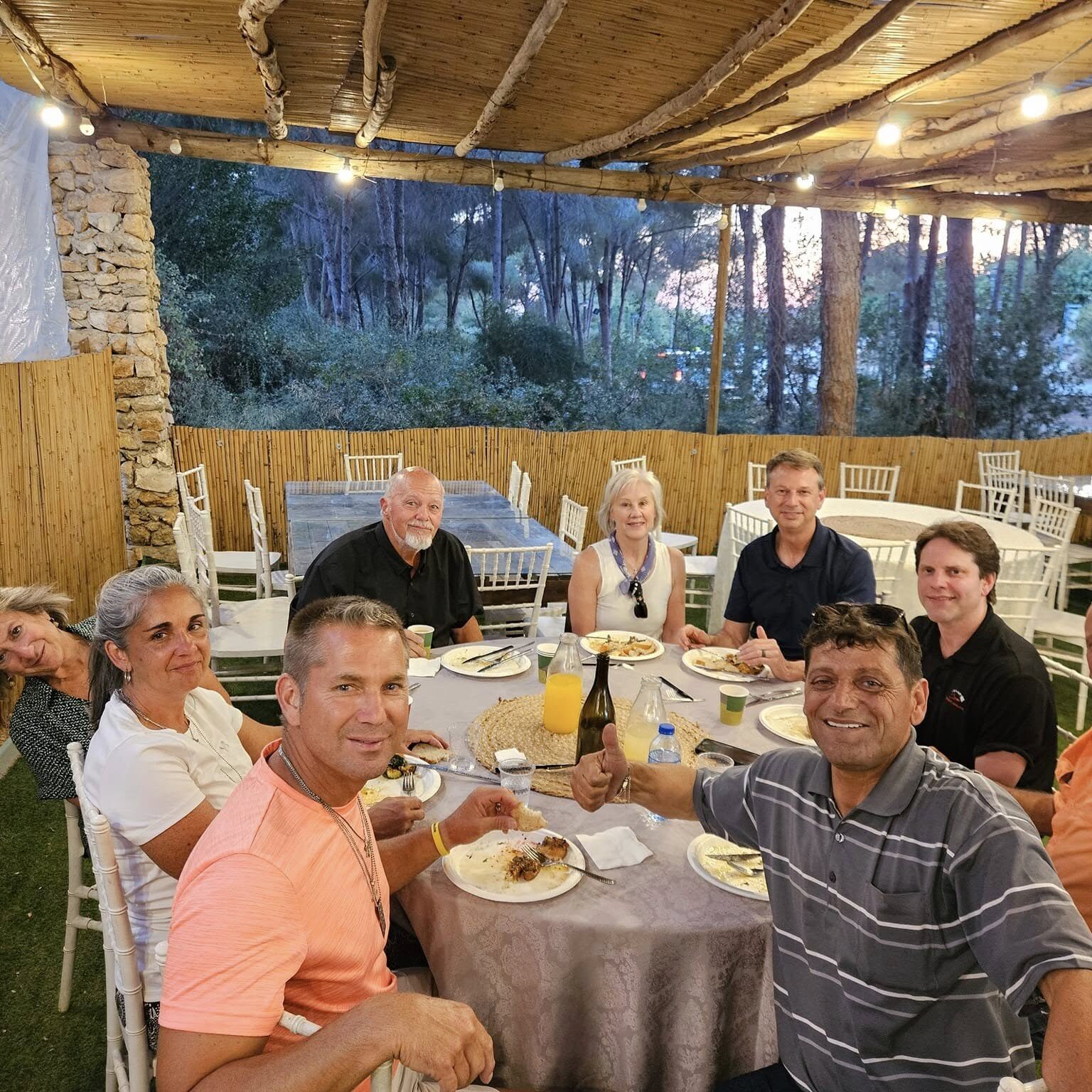 Christians, Jews and Muslims enjoying a meal together.