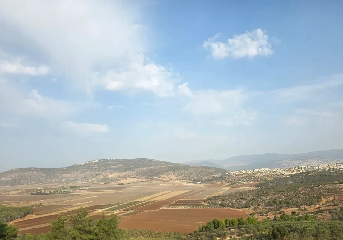 Rural fields with distant hills