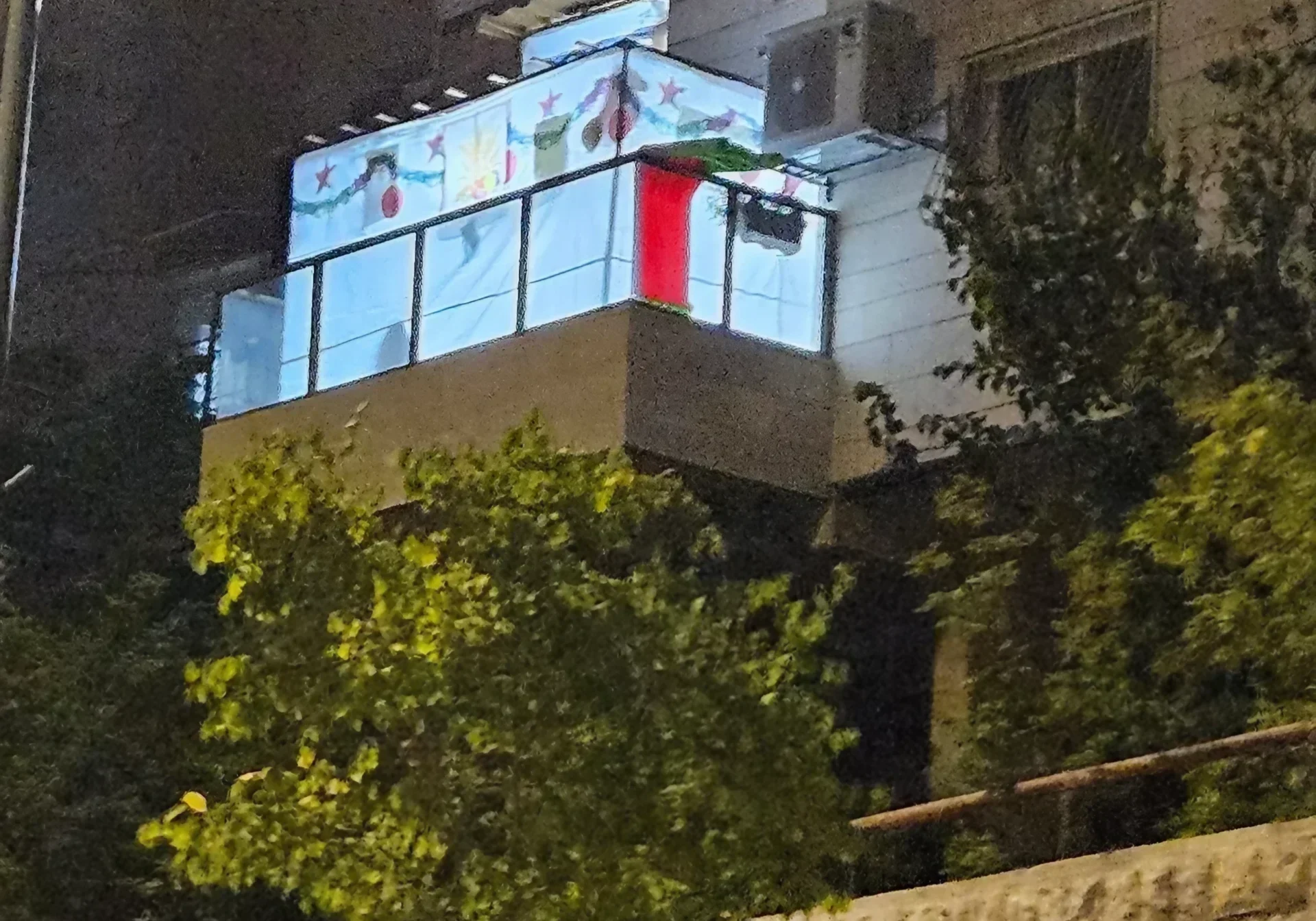 Residential building with lit balcony