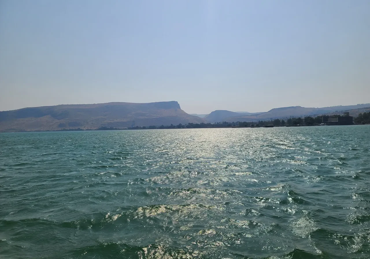 Sparkling lake with distant hills