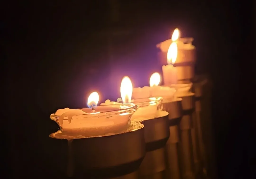 Glowing candles lined in a row