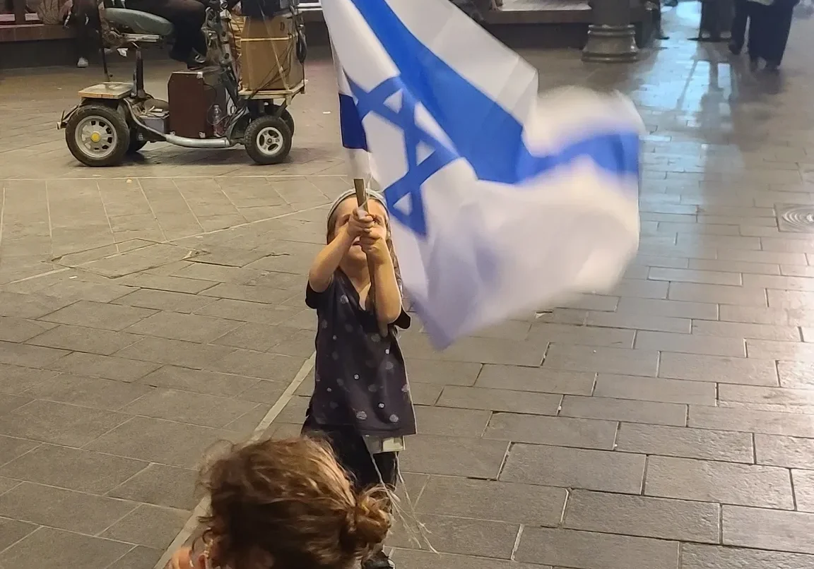 Children playing with flag at night
